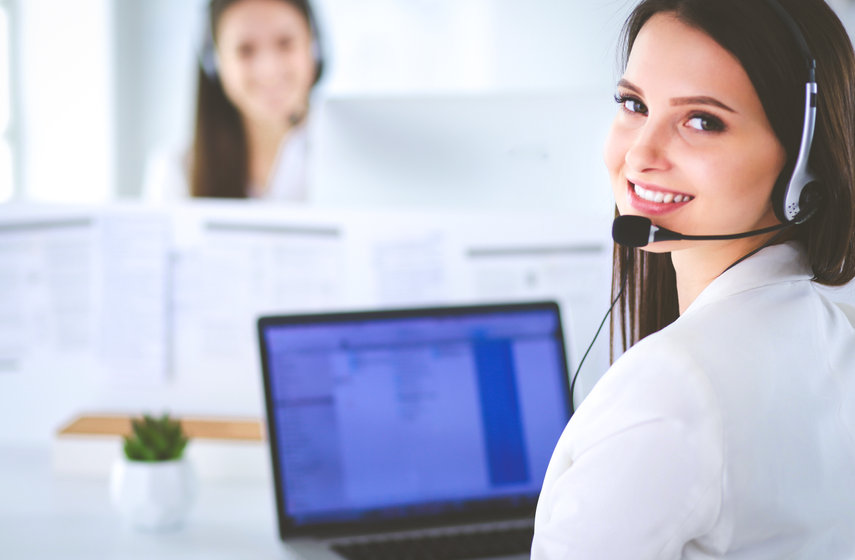 Smiling Businesswoman Or Helpline Operator With Headset And Computer At Office