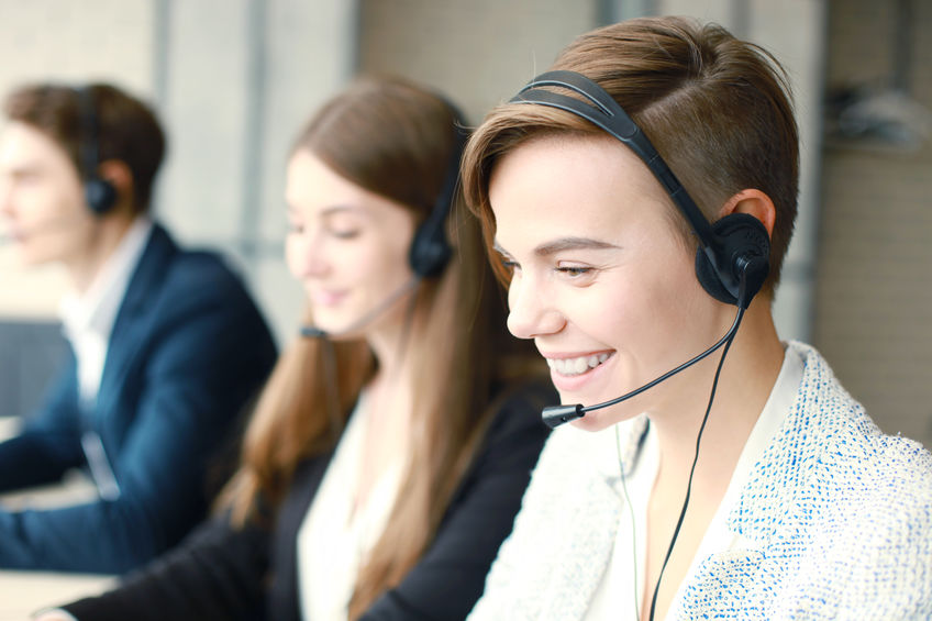 Attractive Positive Young Businesspeople And Colleagues In A Call Center Office.